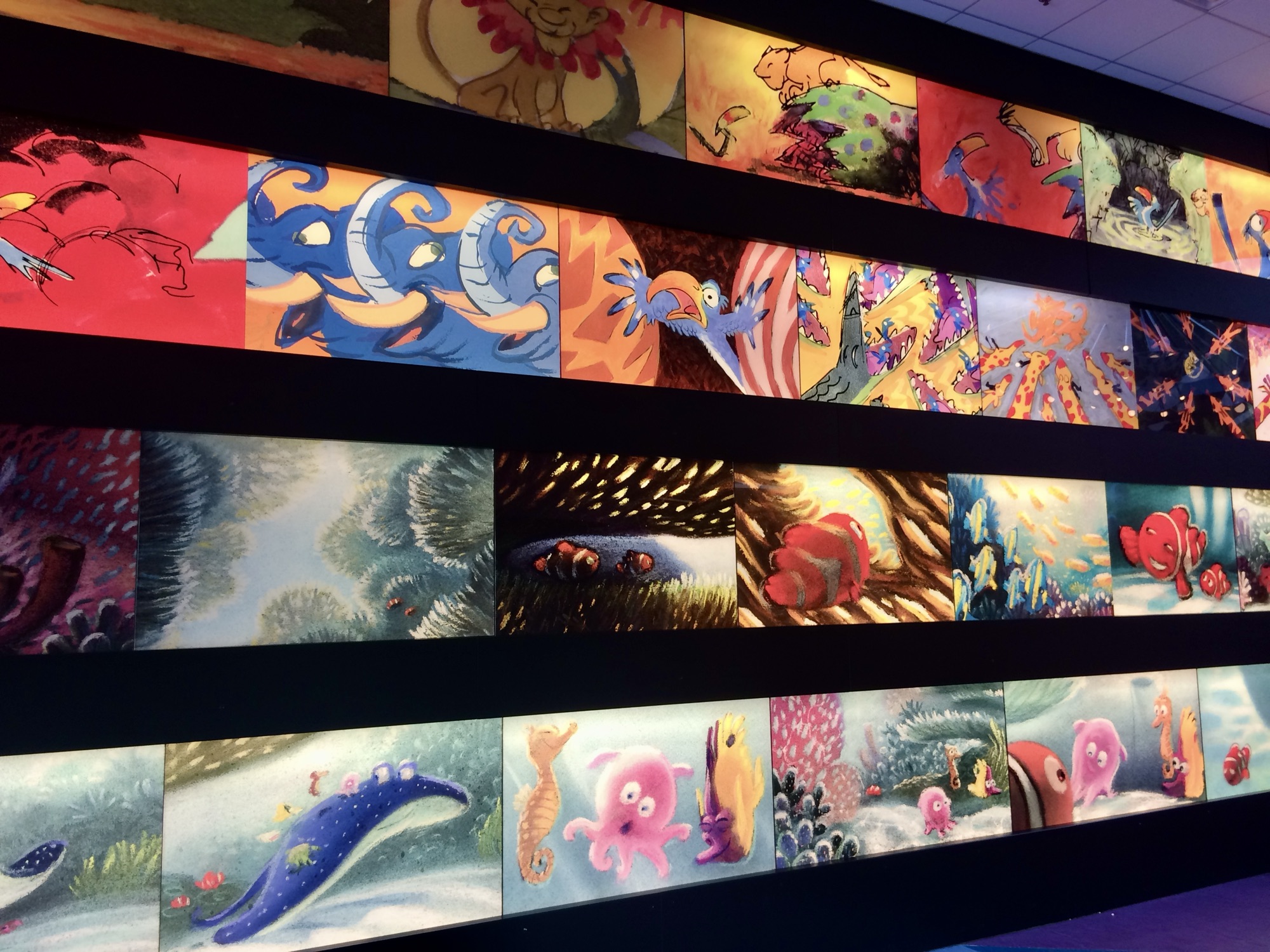 artwork on display in hotel lobby at art of animation resort in Disney world