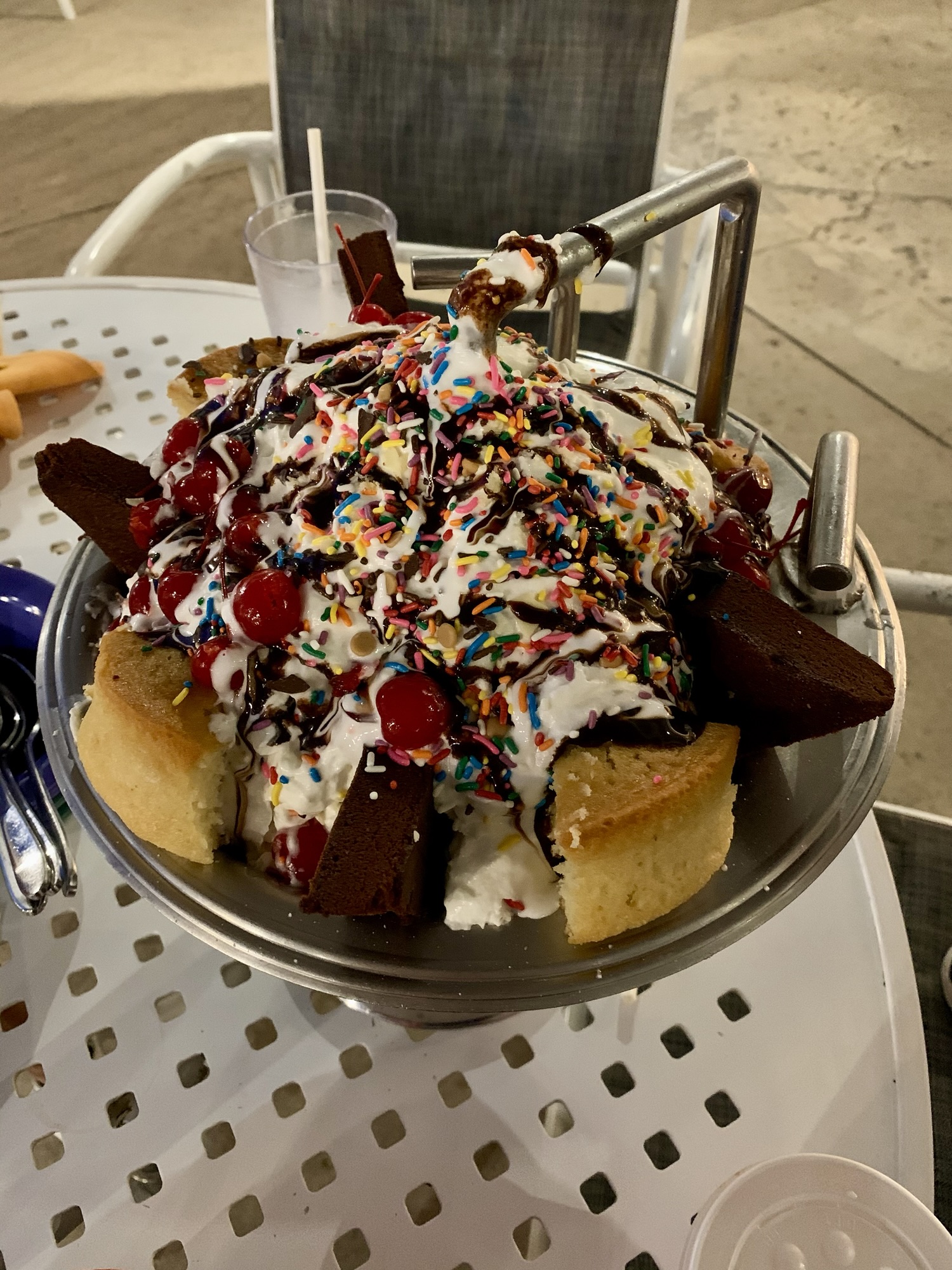 eating the kitchen sink dessert outside Beaches and Cream Soda Shop at the Beach Club Resort in Disney World